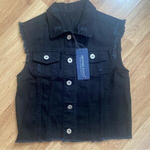 Black denim vest.